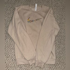 Women’s floral embroidered tan Nike crewneck size small